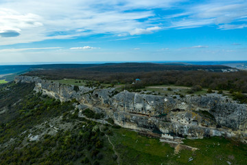 Fototapeta na wymiar Flying drone above the cave city and monastery Chelter-Marmara, near the city of Bakhchisaray, Crimea