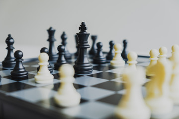 The chess board shows leadership, followers and business success strategies