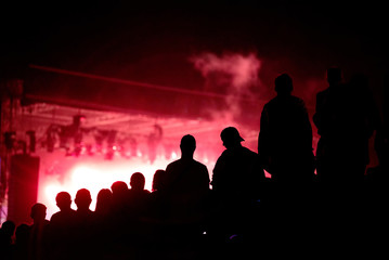 Fototapeta premium Silhouette of concert crowd and stage lights
