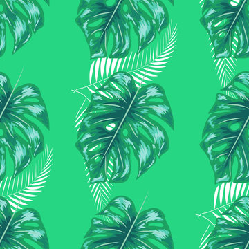 Green pattern with monstera palm leaves. Seamless summer tropical fabric design.