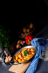 a delicious fried potato and shrimp pan