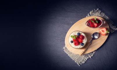 delicious milk rice with different berries and red fruit jelly
