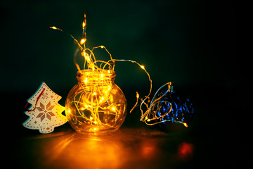 Garland in a bottle, Christmas wallpaper concept. The warmth and comfort of home