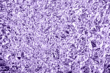 Purple color foil background shiny crumpled surface for background