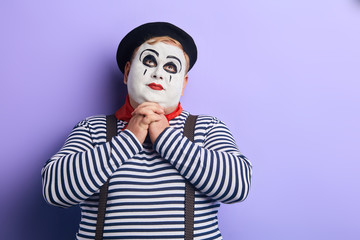 plump clown has a dream. close up photo. copy space. romantic clown thinking about girlfriend,...