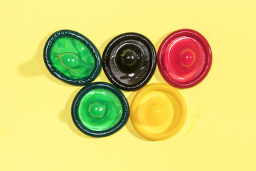 Flat lay colourful unwrapped condoms
