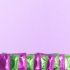 Top view frame with green and pink condoms