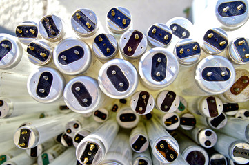large amount of spent old fluorescent lamp tubes about to be recycled. Waste Disposal concept for...