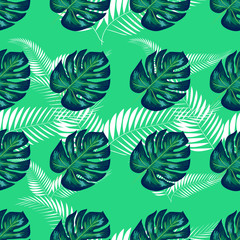 Fototapeta premium Green pattern with monstera palm leaves. Seamless summer tropical fabric design.