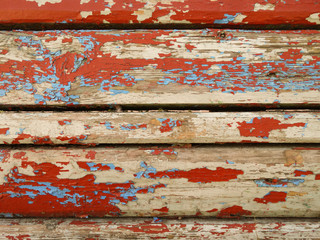 Vintage wood background with peeling paint close up