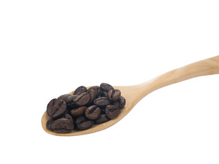 Pile Roasted brown coffee beans on woods spoon isolated on white background.close up
