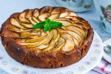 Apple, ginger and honey cake garnished with fresh mint
