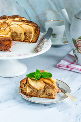 Apple, ginger and honey cake garnished with fresh mint