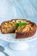 Apple, ginger and honey cake garnished with fresh mint
