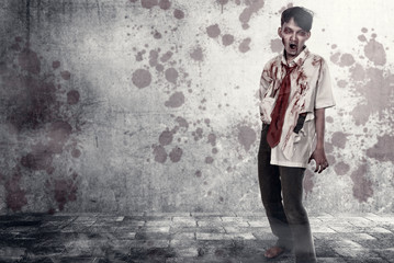 Scary zombies with blood and wound on his body walking on the urban street
