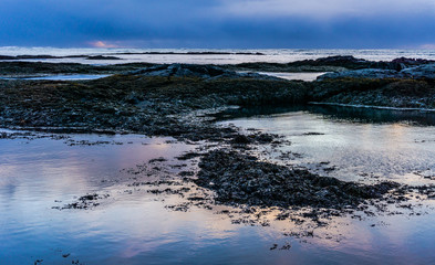 Sunset at rocky beach