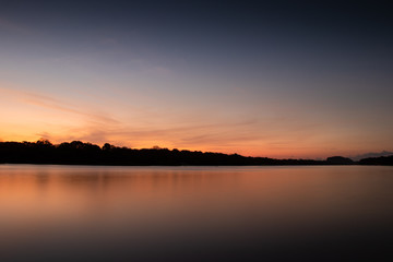 Naklejka na ściany i meble Sunset over lake in Costa Rica