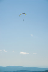 Paraglider flight over the mountains.