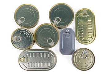 Top view of different sealed tin cans of canned fish