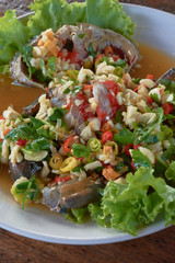 raw mud-crab in fish sauce and Thai recipe spicy sauce topping.