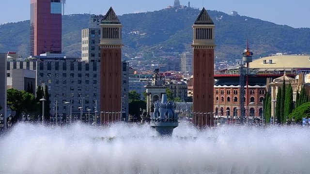 THE MAGICAL FOUNTAIN OF MONTJUIC IN BARCELONA WITH A LOT OF TOURISM AND A LOT OF HEAT IN SUMMER, HOLIDAY CONCEPT