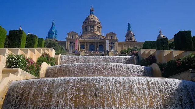 THE MAGICAL FOUNTAIN OF MONTJUIC IN BARCELONA WITH A LOT OF TOURISM AND A LOT OF HEAT IN SUMMER, HOLIDAY CONCEPT