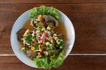 raw mud-crab in fish sauce and Thai recipe spicy sauce topping.