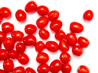 Red cherry tomatoes on a white background