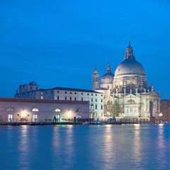 Fototapeta na wymiar Illuminated church Santa Maria della Salute in Venice, Italy at night, copy-space