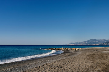 deserted beach in the morning in Bordighera in Liguria in Italy