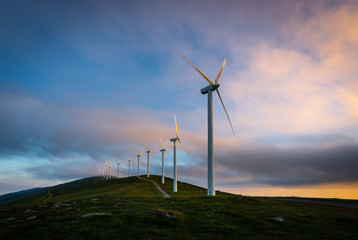 Wind turbines farm at sunrise, Oiz mountain, Basque Country, Spain
