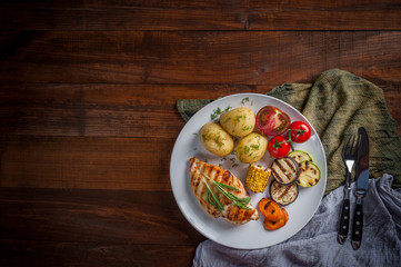 Fried chicken fillet and boiled vegetables