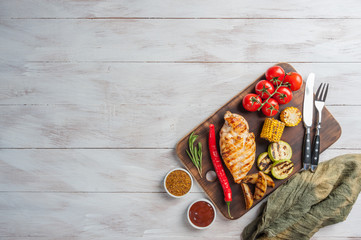 Fried chicken fillet and boiled vegetables