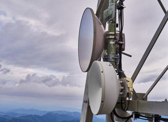 Satellite dishes on a mast on a high mountain in the Alps