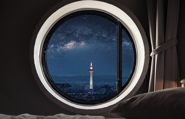 Looking through window, Kyoto city view with starry sky at night in Japan