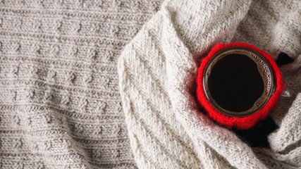 Hygge style coffee Cup. Home comfort in the cold season. Warm, minimalist sweaters