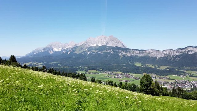 Beautiful alpine landscape with green meadows, alpine mountain peaks, St johan, Tyrol Alps, Austria