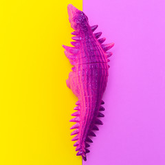  Dinosaurs toys on a colored background. Flat lay minimal art