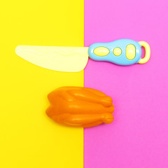Toy plastic chicken. Food creative flat lay art