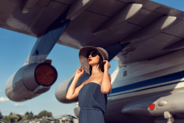 Brunette in a dress at the old airport