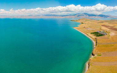 Aerial view of Lake Van the largest lake in Turkey, lies in the far east of that country in the provinces of Van and Bitlis. Fields and cliffs overlooking the crystal clear waters