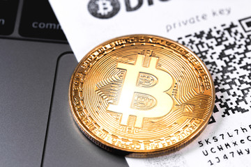 closeup golden bitcoin symbol with private key