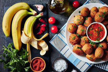 banana fritters Klako on a white plate © myviewpoint