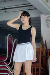 Portrait of thai adult beautiful girl black shirt white skirt relax time