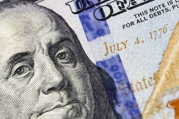 Benjamin Franklin portrait. Hundred dollars new banknote closeup macro