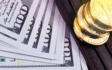 closeup stack metal coins, dollars banknotes with wallet