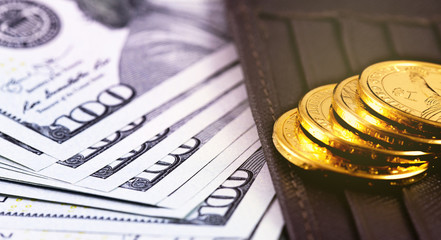 closeup stack metal coins, dollars hundred banknotes with wallet