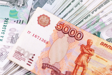closeup stack of Russian rubles 1000 and 5000 banknotes