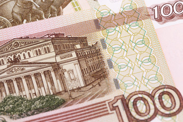 macro closeup Russian bankontes 100 rubles. General view of the building of the Bolshoi Theater (Moscow)