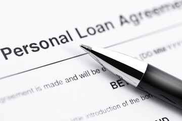 personal loan application form with black pen closeup